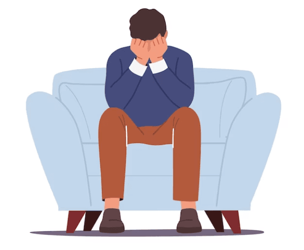 Man sitting tensed on a sofa